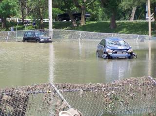 vehicles washed onto ball field.jpg